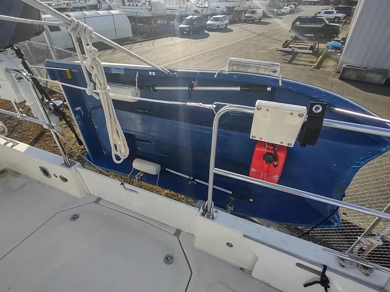 Slide: The Image of 2002 Endeavour Trawlercat 36 deck with blue dinghy and safety equipment. - 16