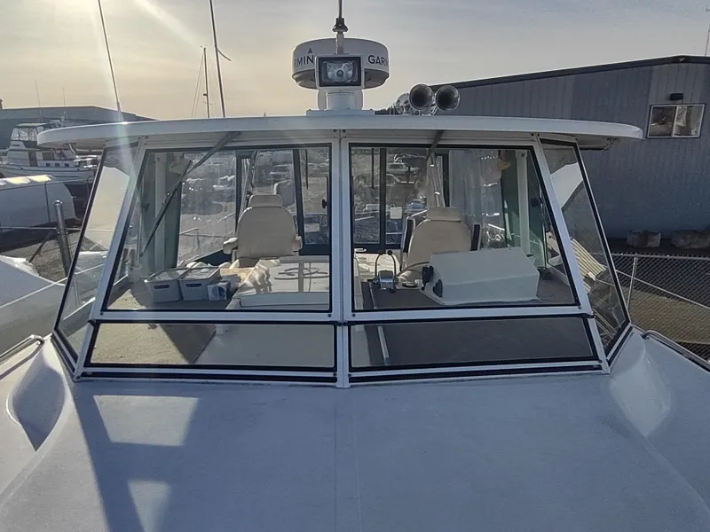 Slide: The Image of 2002 Endeavour Trawlercat 36 boat with enclosed cockpit and navigation equipment. - 27