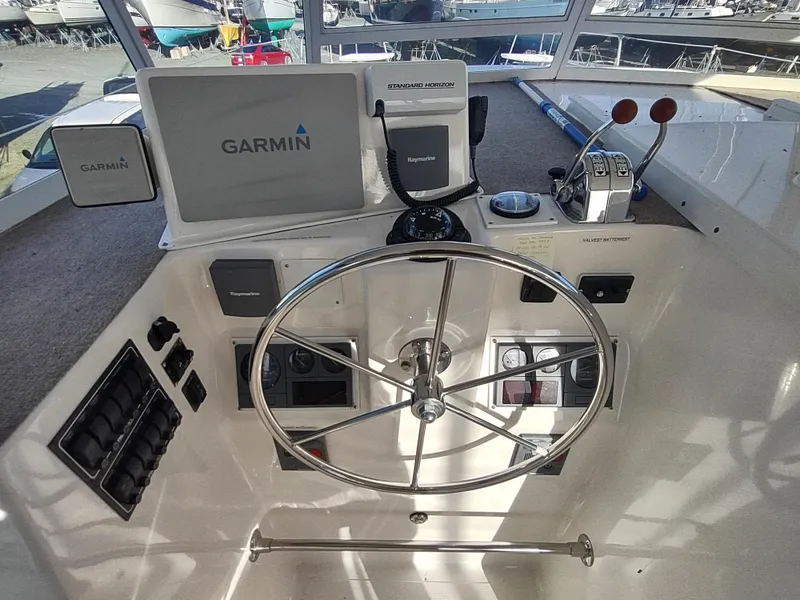 Slide: The Image of Helm of 2002 Endeavour Trawlercat 36 with Garmin navigation system. - 36