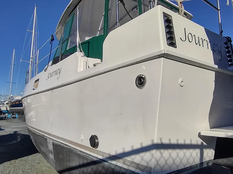 Slide: The Image of 2002 Endeavour Trawlercat 36 boat named "Journey" docked, side view. - 7