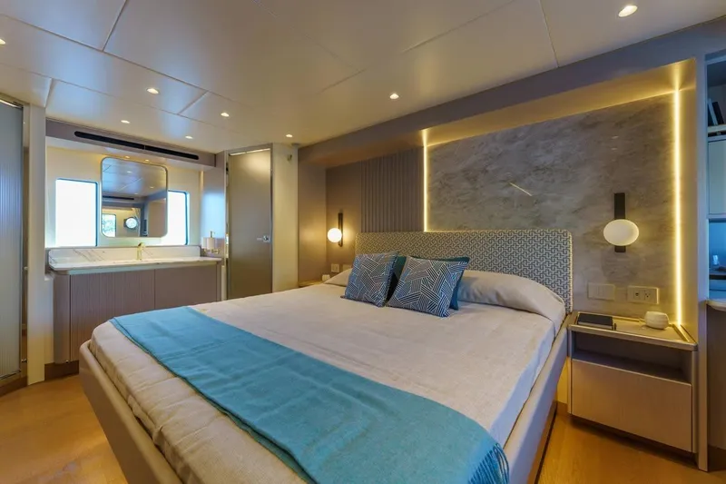 Slide: The Image of Luxurious bedroom interior of 2026 Absolute 70' Fly yacht with modern design and ambient lighting. - 18