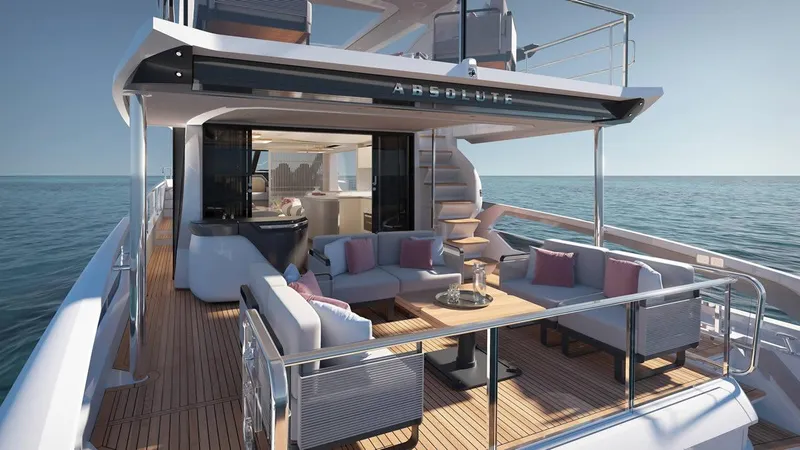 Slide: The Image of Luxury Absolute 70' Fly yacht on serene ocean, 2026 model, with scenic coastal backdrop. - 4