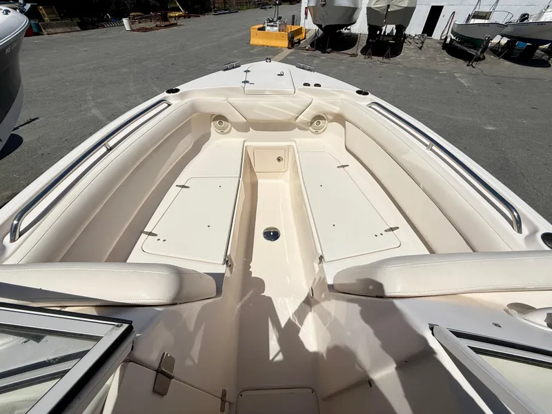 Slide: The Image of 2017 Grady-White Freedom 275 boat interior with spacious seating and storage. - 11