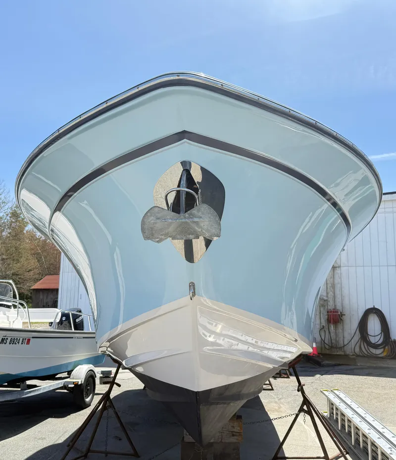 Slide: The Image of 2017 Grady-White Freedom 275 boat on stands, viewed from the front. - 3