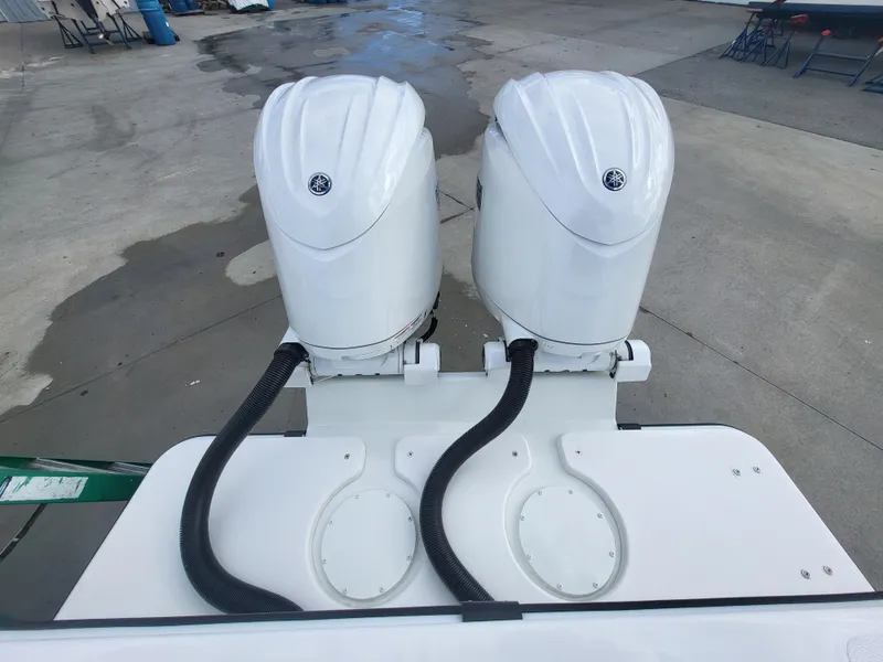 Slide: The Image of Twin outboard motors on a 2025 Steiger Craft 255 DV MIAMI boat. - 21