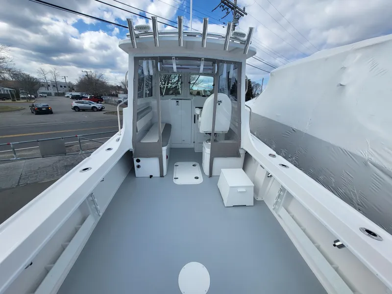 Slide: The Image of 2025 Steiger Craft 255 DV MIAMI boat with spacious deck and modern design. - 23
