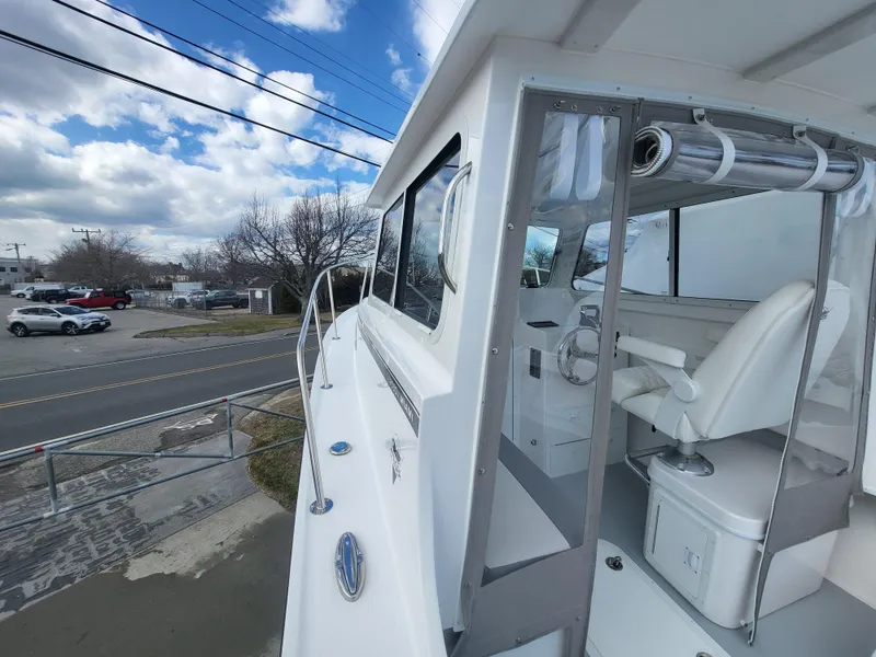 Slide: The Image of 2025 Steiger Craft 255 DV MIAMI boat, exterior view with cockpit and seating. - 24
