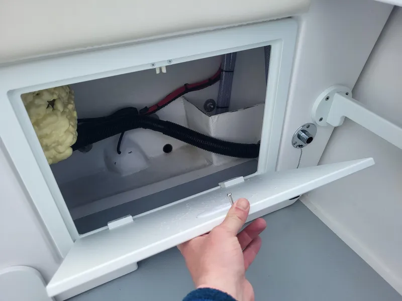 Slide: The Image of Access panel of 2025 Steiger Craft 255 DV MIAMI boat, showing internal wiring and components. - 40