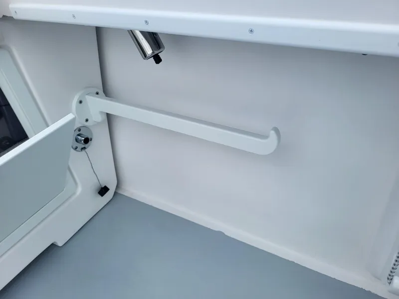 Slide: The Image of 2025 Steiger Craft 255 DV MIAMI boat interior detail with rod holder and storage compartment. - 41