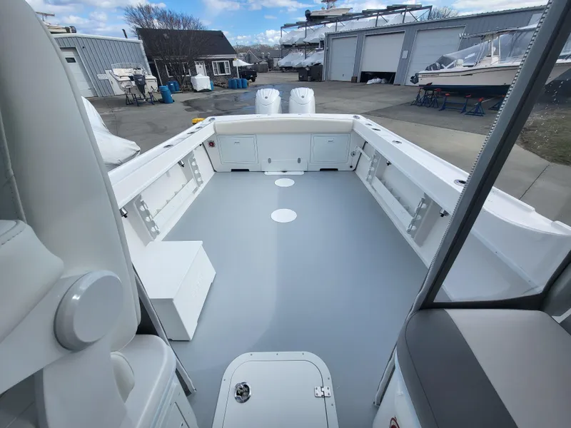 Slide: The Image of 2025 Steiger Craft 255 DV MIAMI boat interior, spacious deck, marina background. - 44