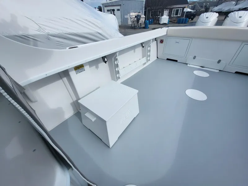 Slide: The Image of 2025 Steiger Craft 255 DV MIAMI boat deck with storage and seating. - 45