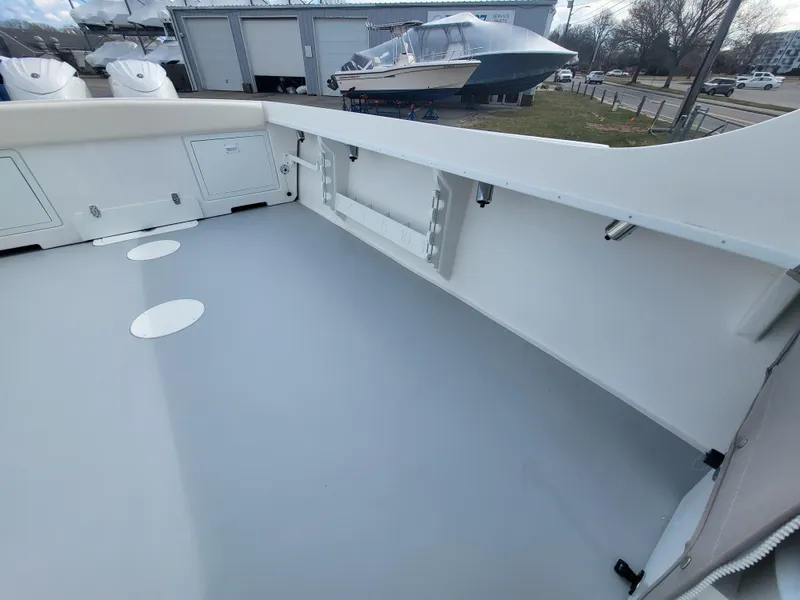 Slide: The Image of 2025 Steiger Craft 255 DV MIAMI boat deck, spacious and clean, with storage compartments. - 46