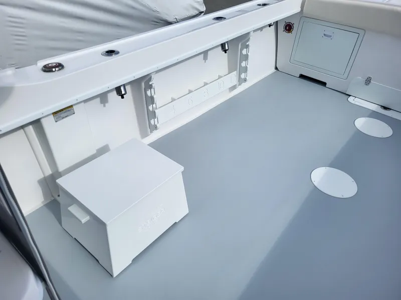 Slide: The Image of 2025 Steiger Craft 255 DV MIAMI boat deck with storage and seating area. - 48