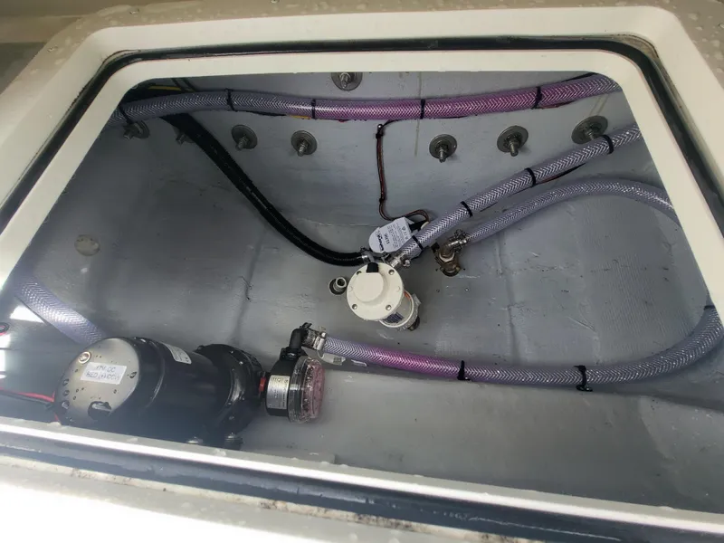 Slide: The Image of Bilge area of 2025 Steiger Craft 255 DV MIAMI with pumps and hoses. - 49