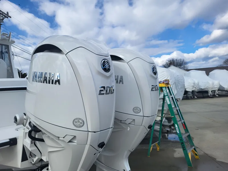 Slide: The Image of Twin Yamaha 200 outboard engines on a 2025 Steiger Craft 255 DV MIAMI boat. - 8