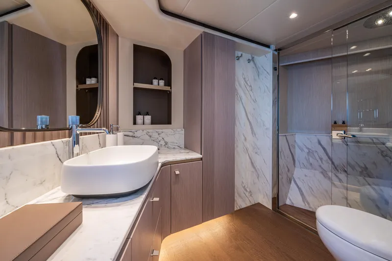 Slide: The Image of Luxurious bathroom on 2026 Absolute 62' Navetta yacht with marble accents and modern fixtures. - 23