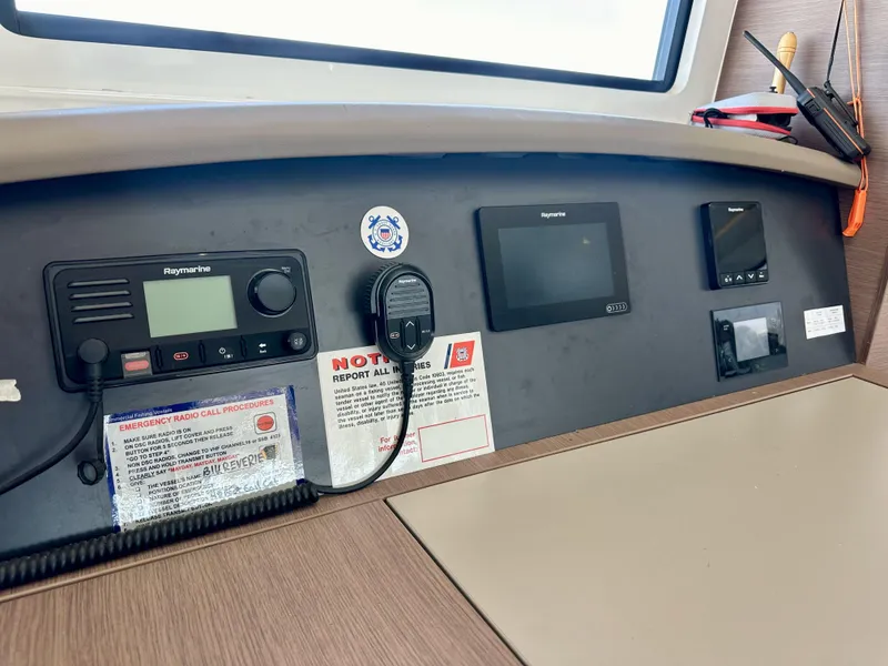 Slide: The Image of Control panel of a 2021 Bali 4.8 yacht with navigation and communication equipment. - 38