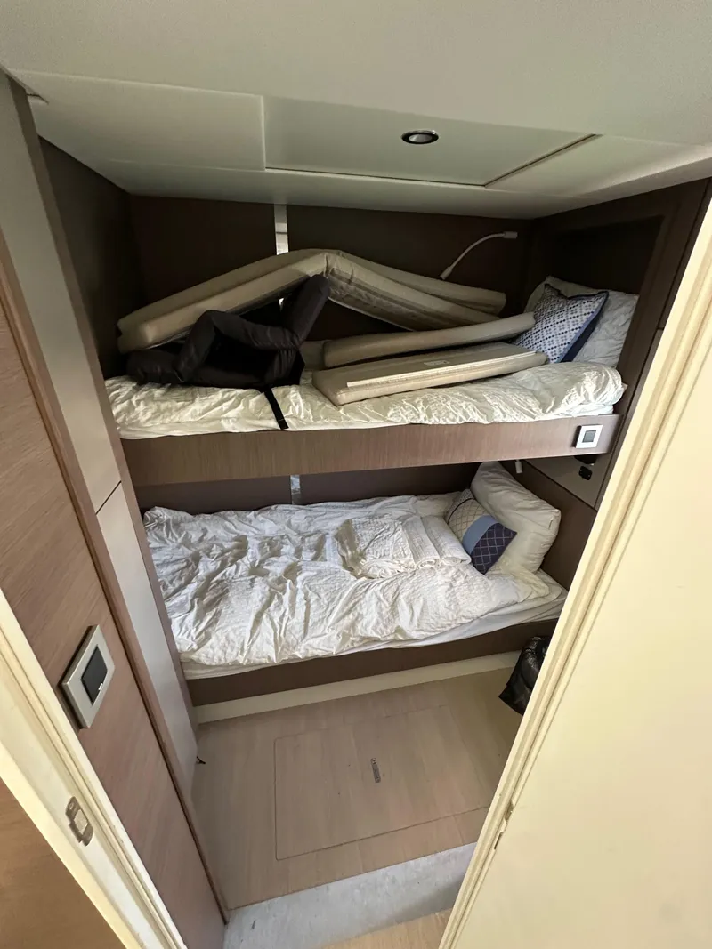 Slide: The Image of Bunk beds in a 2021 Bali 4.8 yacht cabin with modern design and cozy bedding. - 49