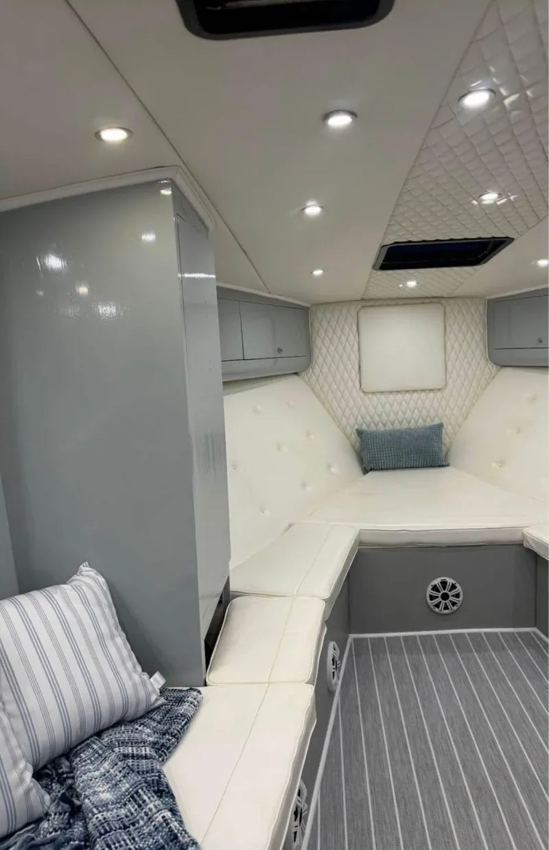 Slide: The Image of Luxurious interior of a 1997 Strike 42 yacht with modern seating and ambient lighting. - 11