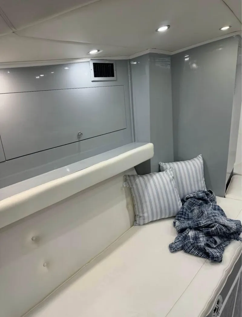 Slide: The Image of Cozy interior of a 1997 Strike 42 boat with cushions and blanket. - 13