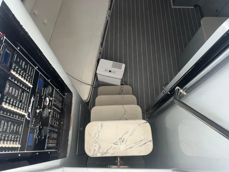 Slide: The Image of Interior of a 1997 Strike 42 boat with control panel and marble steps. - 14