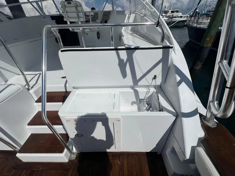 Slide: The Image of 1997 Strike 42 yacht deck with sink and wooden steps. - 22