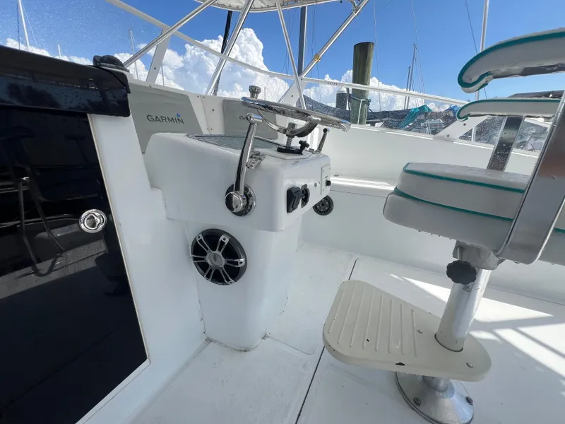Slide: The Image of Helm of 1997 Strike 42 boat with Garmin equipment and seating. - 29