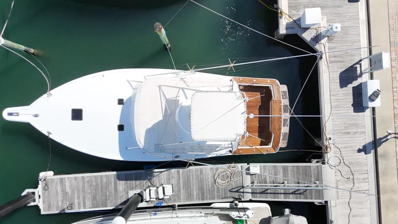Slide: The Image of Aerial view of a 1997 Strike 42 yacht docked at a marina. - 4