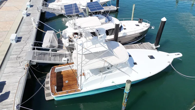 Slide: The Image of Aerial view of a 1997 Strike 42 yacht docked at a marina. - 5