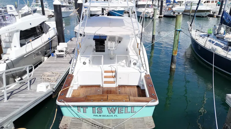 Slide: The Image of A 1997 Strike 42 boat named "It Is Well" docked in Palm Beach, FL marina. - 6