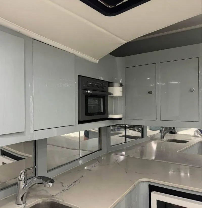 Slide: The Image of Modern kitchen interior in a 1997 Strike 42 yacht, featuring sleek cabinets and appliances. - 9