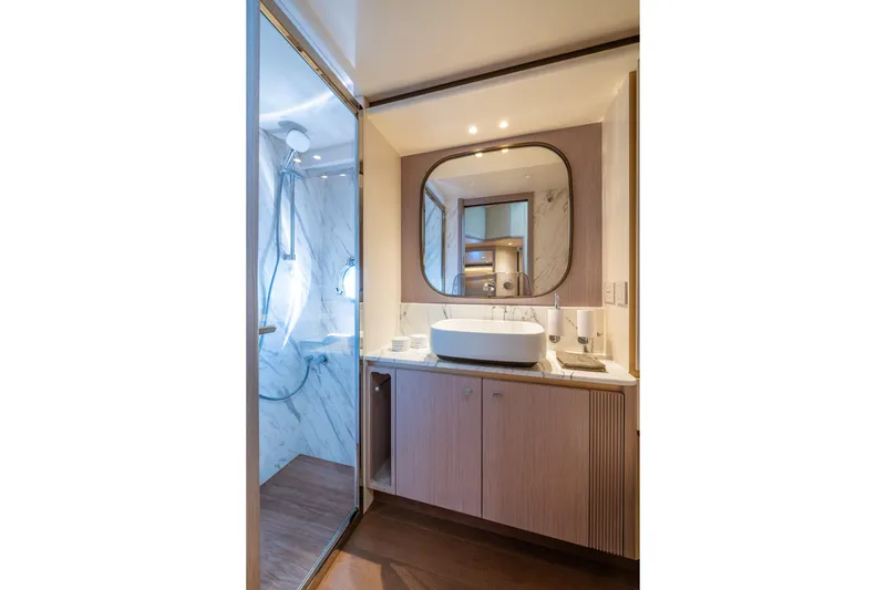 Slide: The Image of Luxurious bathroom on 2026 Absolute 62' Navetta yacht with modern fixtures and elegant design. - 27