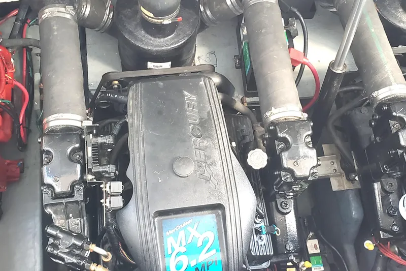 Slide: The Image of Engine of a 2002 Sea Ray 340 Sundancer boat, featuring Mercury MX 6.2 components. - 22