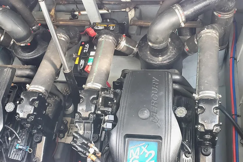 Slide: The Image of Engine compartment of a 2002 Sea Ray 340 Sundancer with Mercury MX 6.2 components. - 23