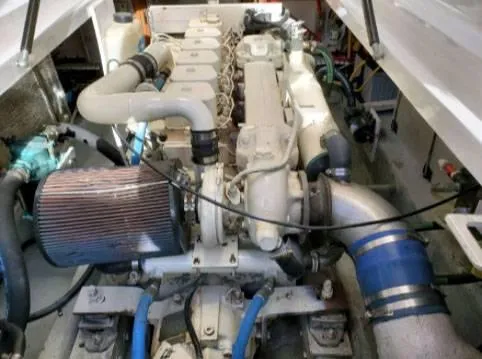 Slide: The Image of Engine compartment of a 1999 Mainship Pilot 30 boat, showcasing mechanical components. - 10