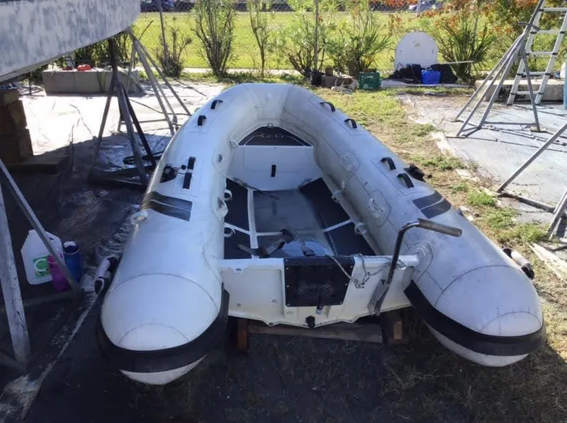 Slide: The Image of Inflatable boat on grass near Jeanneau Sun Odyssey 36.2, 1997 model. - 10