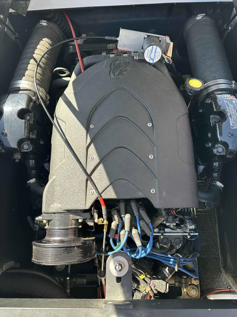 Slide: The Image of 2007 Sanger V215 engine compartment with visible components and wiring. - 13