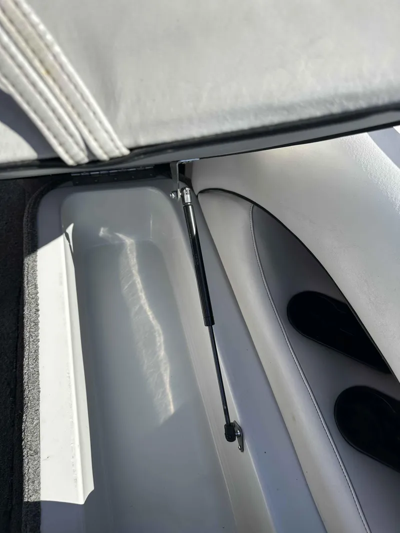 Slide: The Image of 2007 Sanger V215 boat storage compartment with hydraulic lift support. - 15