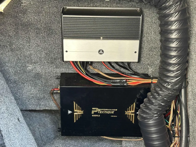 Slide: The Image of Audio amplifiers installed in a 2007 Sanger V215 boat, featuring JL Audio and Performance Teknique. - 16