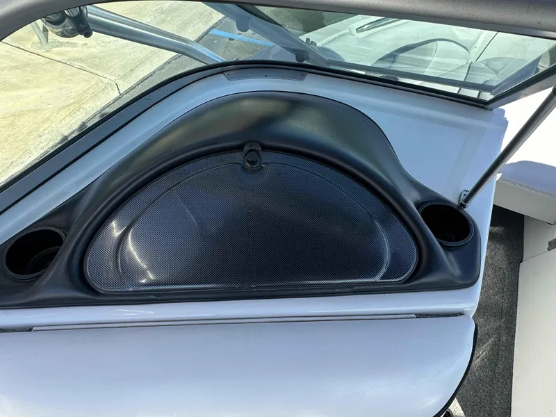 Slide: The Image of 2007 Sanger V215 boat dashboard with cup holders and windshield. - 20