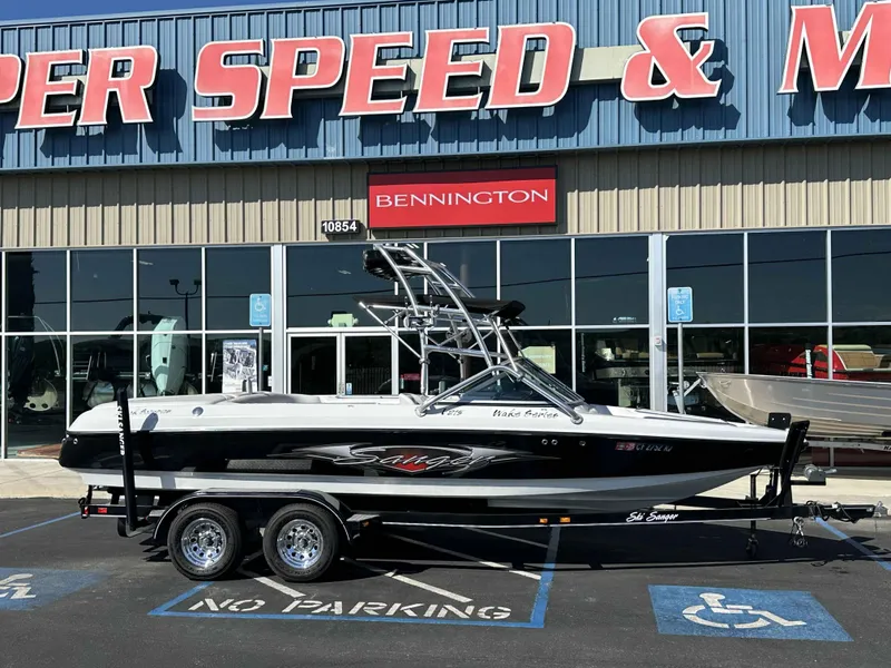 Slide: The Image of 2007 Sanger V215 boat on trailer outside dealership, parked in a handicap spot. - 8