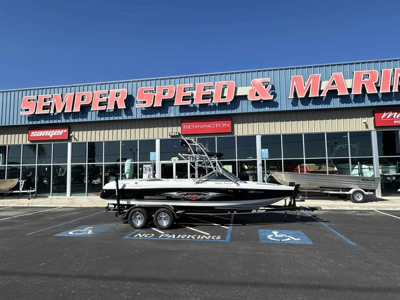 Slide: The Image of 2007 Sanger V215 boat parked outside Semper Speed & Marine dealership. - 9