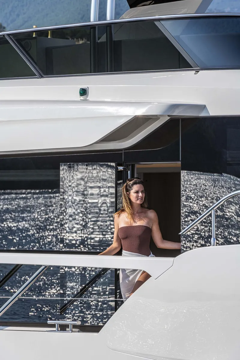 Slide: The Image of Woman enjoying the view on a 2026 Absolute 70' Navetta yacht. - 14