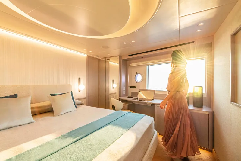 Slide: The Image of Luxurious bedroom interior on 2026 Absolute 70' Navetta yacht, featuring elegant design and natural lighting. - 25