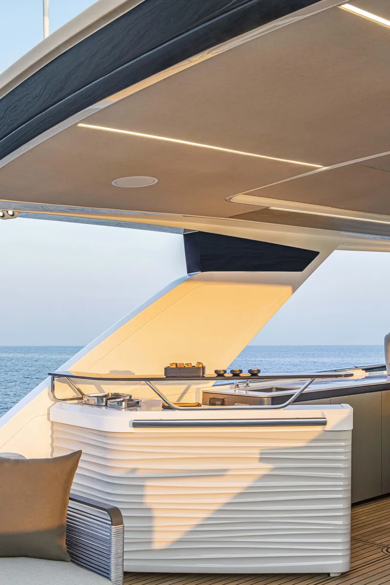 Slide: The Image of Luxurious 2026 Absolute 70' Navetta yacht deck with modern design and ocean view. - 17
