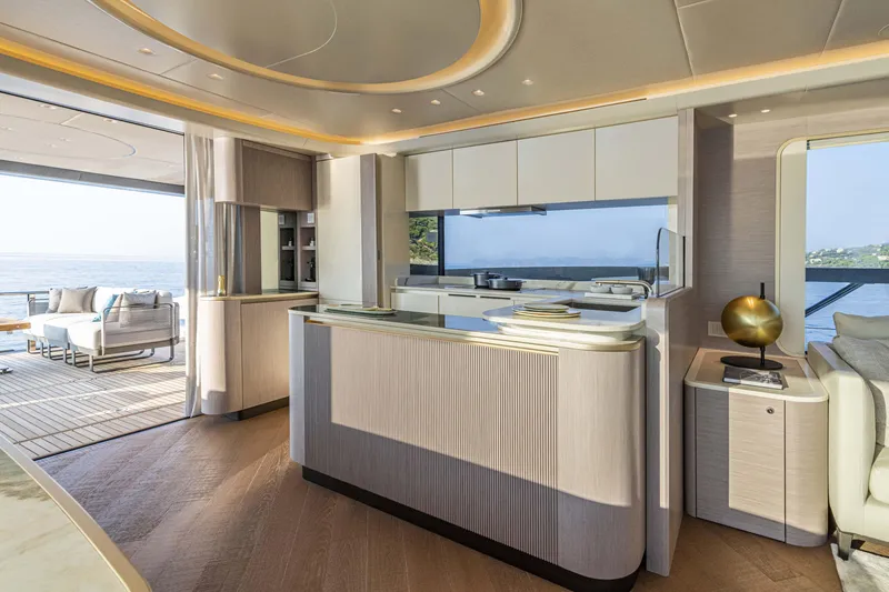 Slide: The Image of Luxurious interior of 2026 Absolute 70' Navetta yacht with modern kitchen and ocean view. - 21