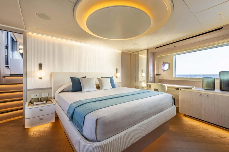 Slide: The Image of Luxurious bedroom interior on 2026 Absolute 70' Navetta yacht with modern design and ambient lighting. - 23
