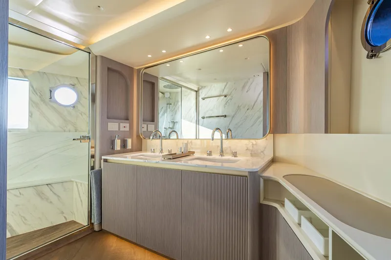 Slide: The Image of Luxurious bathroom in 2026 Absolute 70' Navetta yacht with dual sinks and modern design. - 24