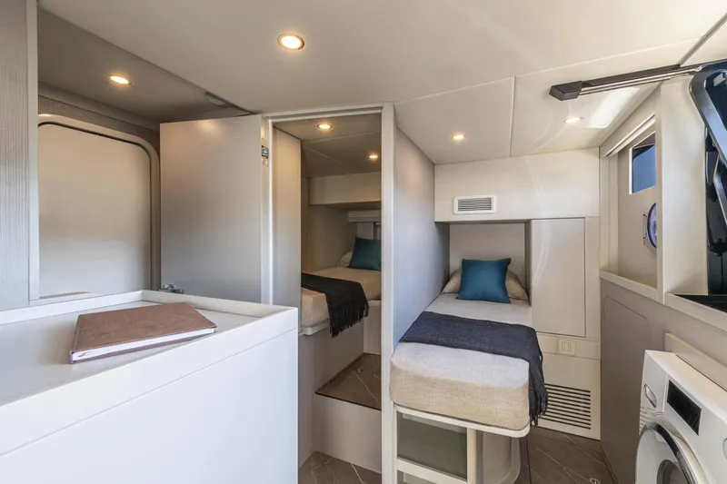 Slide: The Image of Interior of 2026 Absolute 70' Navetta yacht with cozy twin beds and modern amenities. - 30