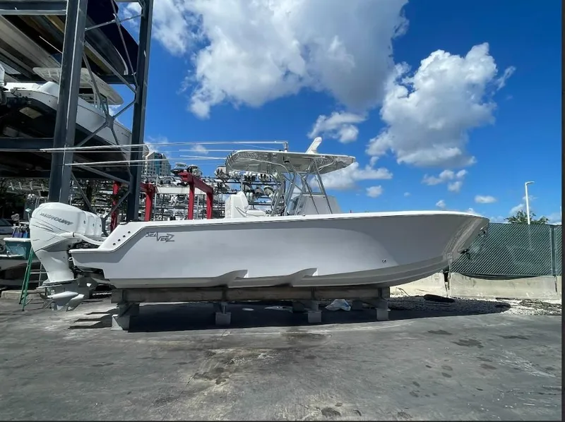 Slide: The Image of 2020 SeaVee 340Z boat on dry dock under a bright blue sky. - 1